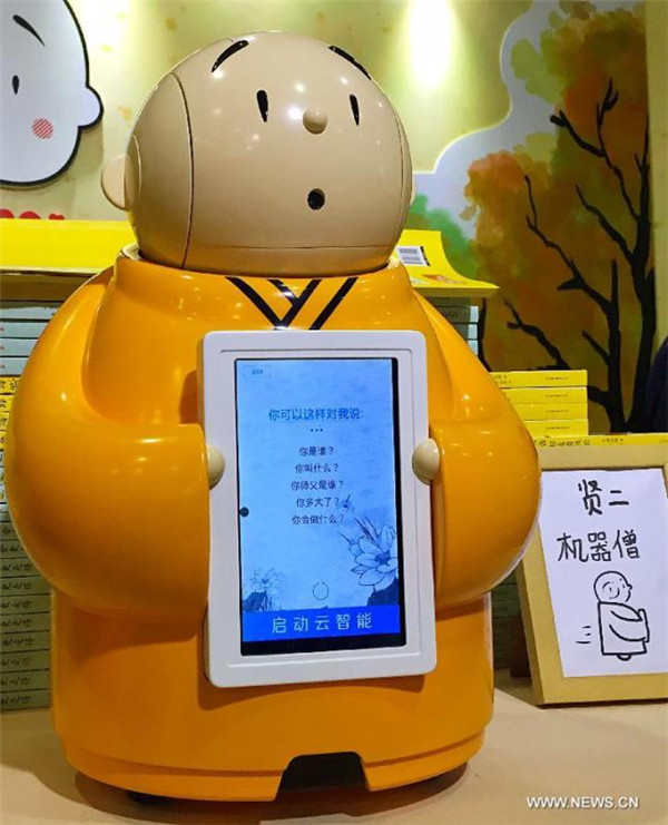 Robot monk with artificial intelligence makes debut
