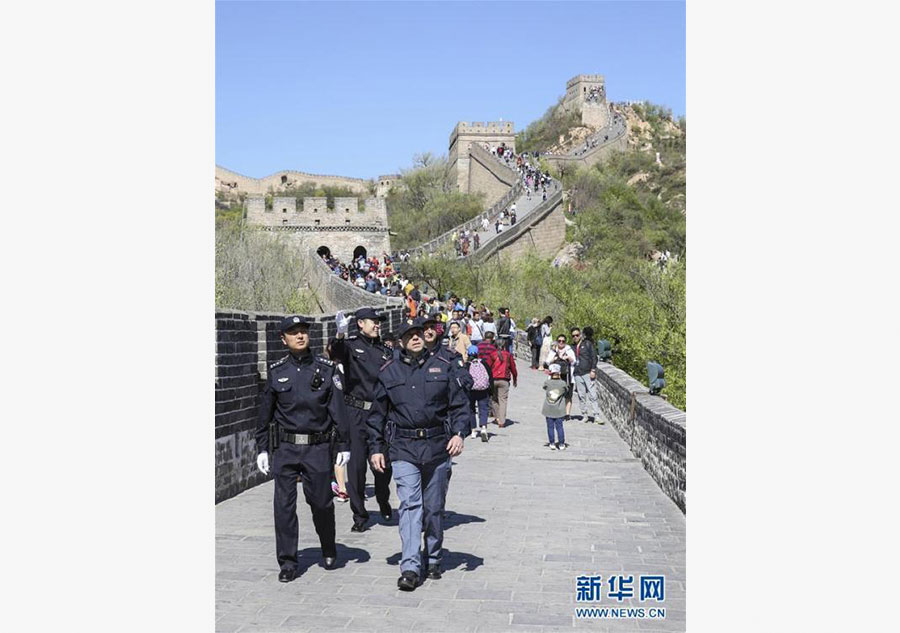 Italian police officers walk beats on Great Wall