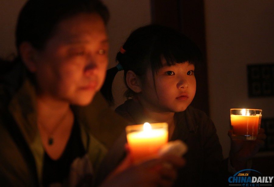 馬航MH370失聯(lián)客機(jī)整月 家屬為親人祈福守望