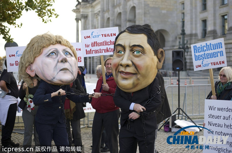 德民眾棄默克爾與社民黨主席“頭顱” 抗議兩黨聯(lián)合執(zhí)政
