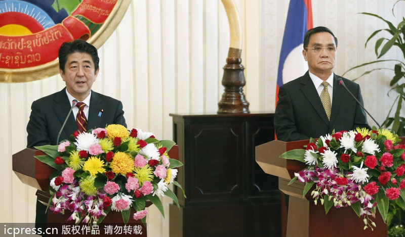 安倍晉三訪(fǎng)問(wèn)老撾 以金援換支持“入常”（圖）
