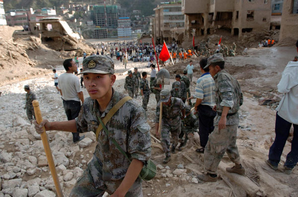 Frantic search for signs of life after landslide