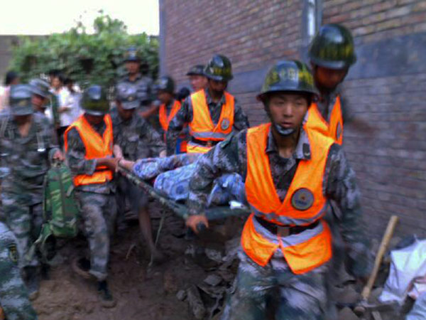 Frantic search for signs of life after landslide