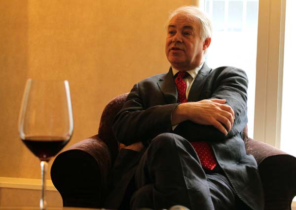 Raising his glass