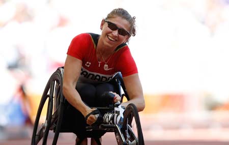 Canada&apos;s Michelle Stilwell reacts after women&apos;s 200M T52 final at the National Stadium，also known as the Bird&apos;s Nest，during the Beijing 2008 Paralympic Games in Beijing, Sept. 11, 2008. Stilwell won the gold medal with 36.18 seconds.(