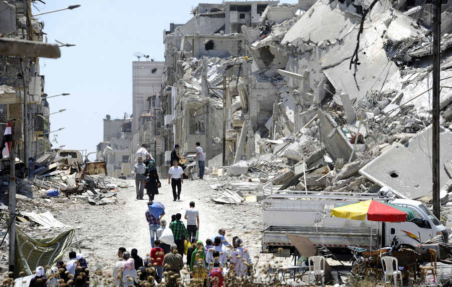 Syrians return to damaged homes