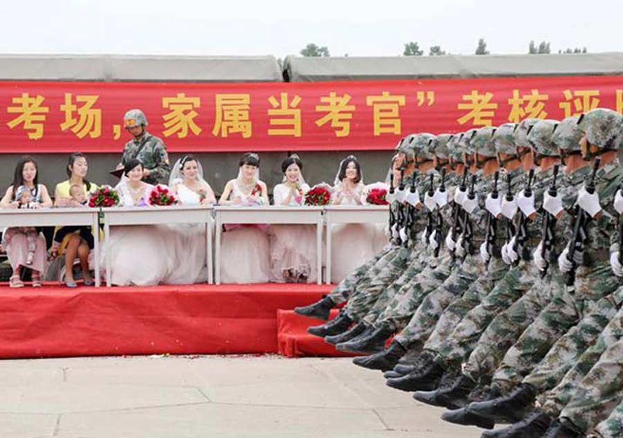 V-Day parade soldiers have group wedding
