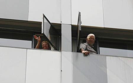 Travellers are quarantined in Hong Kong hotel