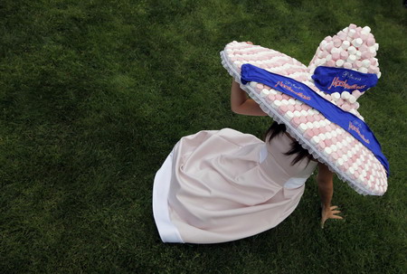 UK Royal Ascot: He on horse, she in hat