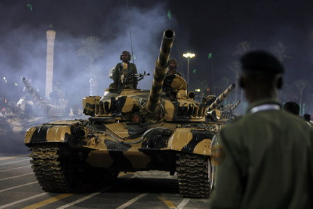 Hugs from Chavez as Gaddafi's Libya reaches 40