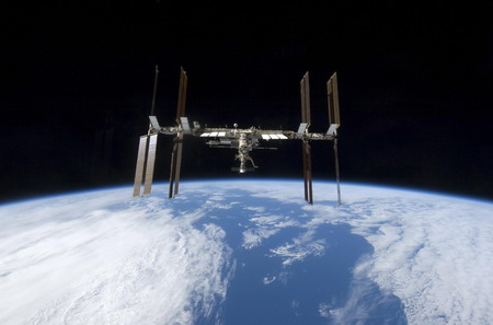 Space shuttle begins its journey home