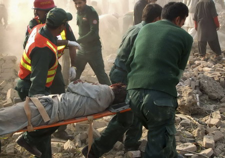 Blast kills 33 near lawmaker's home in Pakistan