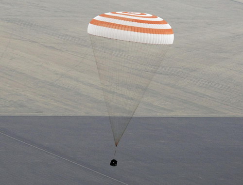 Russian-US space crew heads for Earth