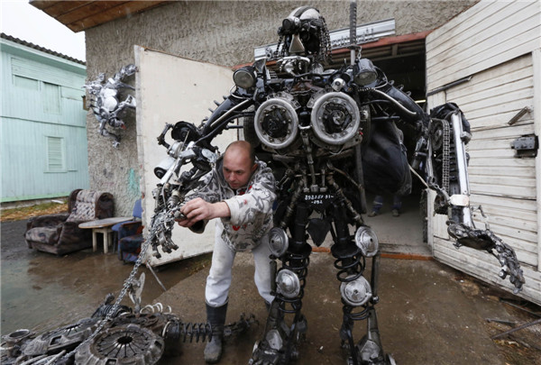 Mechanic creats mobile robots made of used car parts