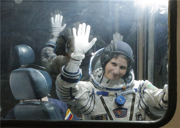 Multi-national crew blasts off for space station